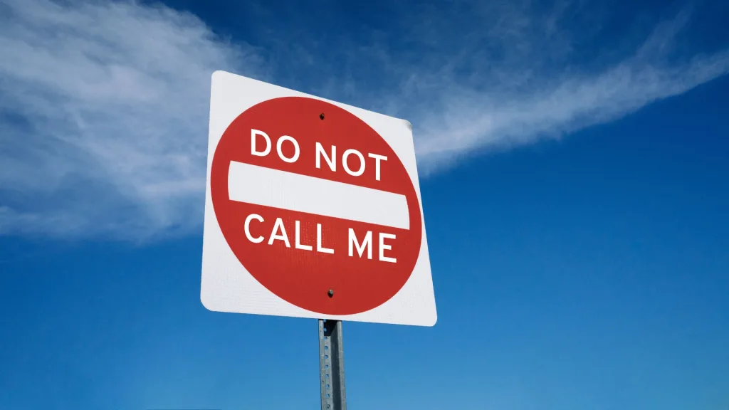 Red sign reads 'Do Not Call Me'.